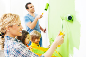 Portrait of a happy family holding paint rollers and painting wall in green. [url=http://www.istockphoto.com/search/lightbox/9786778][img]http://dl.dropbox.com/u/40117171/family.jpg[/img][/url]